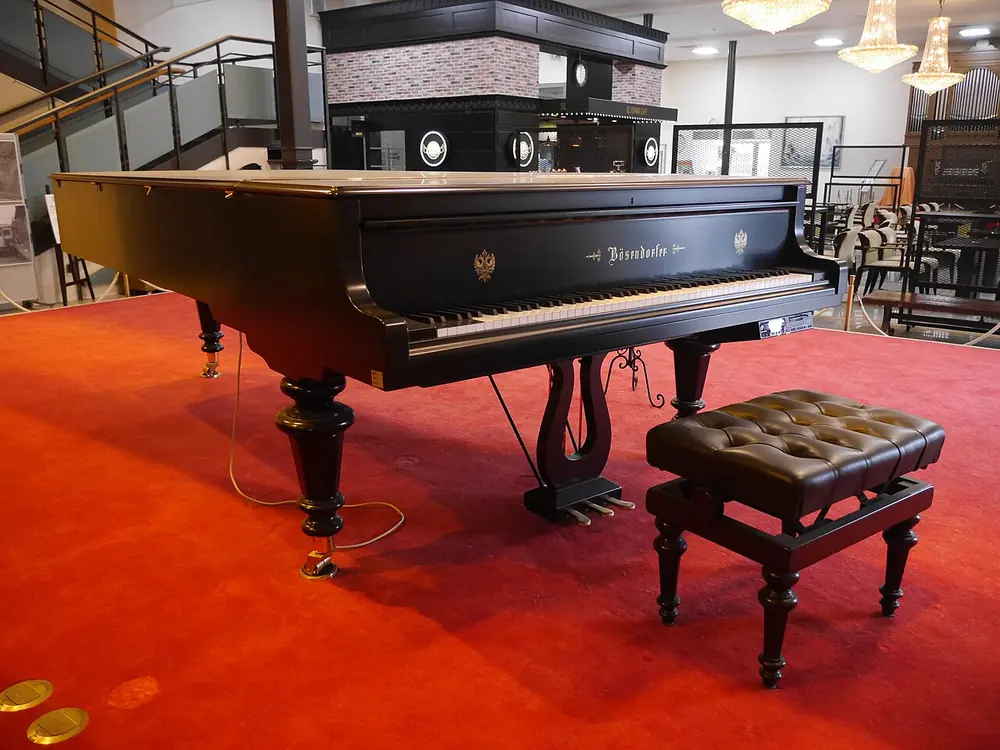 Bösendorfer Model 290 Imperial grand in a hall with a red carpet