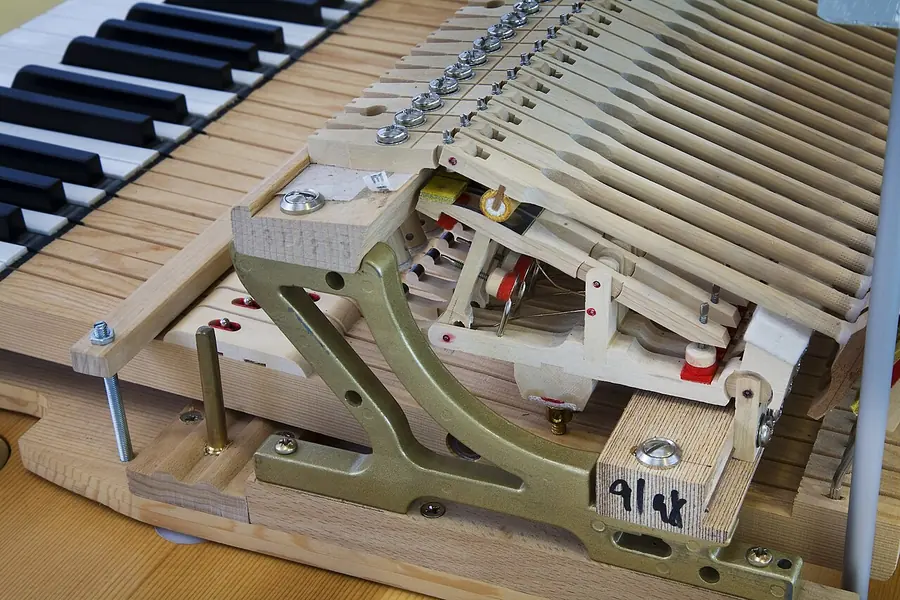 Grand piano action mechanism removed from the instrument